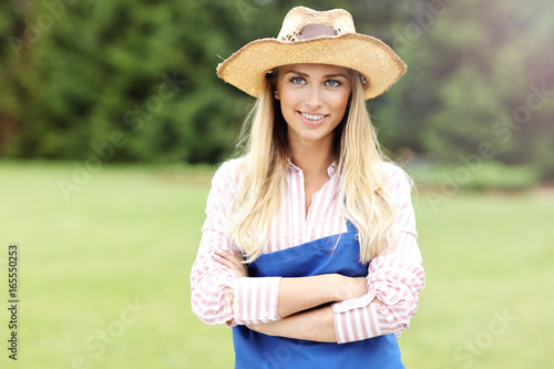 Woman gardener standing outside