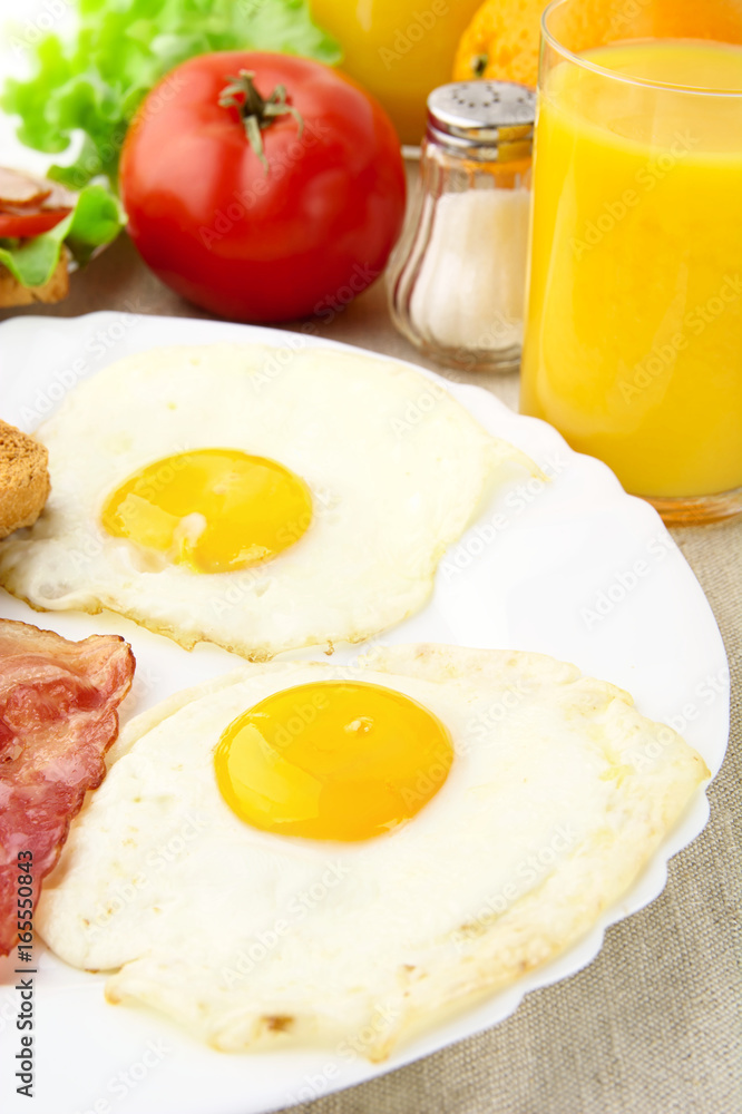 Healthy breakfast with two eggs with glass of juice Healthy breakfast with two eggs with glass of juice