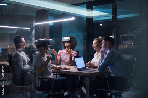 Multiethnic Business team using virtual reality headset photo