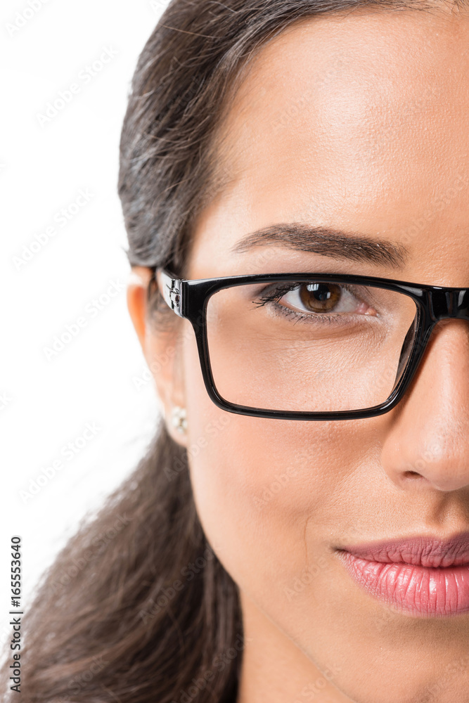 portrait of young smiling businesswoman in eyeglasses looking at camera isolated on white portrait of young smiling businesswoman in eyeglasses looking at camera isolated on white