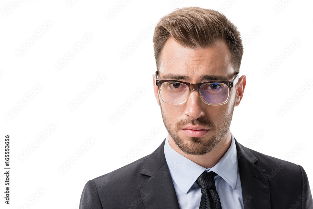 portrait of young businessman in eyeglasses looking at camera isolated on white portrait of young businessman in eyeglasses looking at camera isolated on white