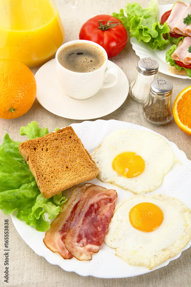 Unhealthy fatty breakfast with cup of coffee with bacon,eggs