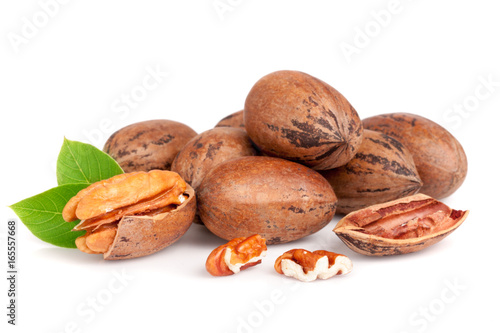 heap of pecan with leaves isolated on white background