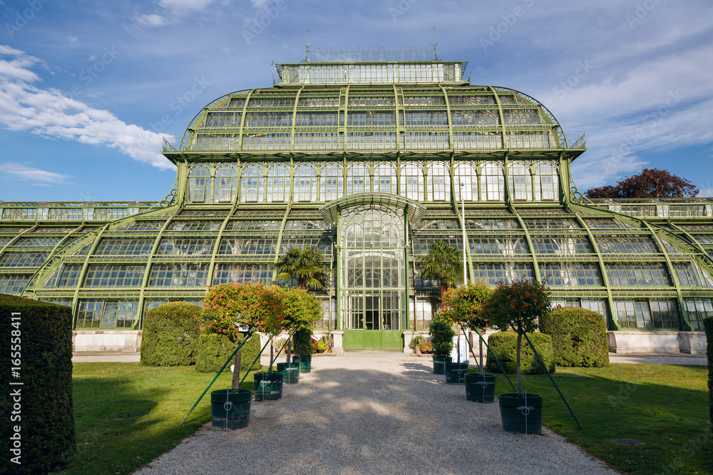 Fototapeta premium The Palmenhaus Schoenbrunn - a large greenhouse, opened in 1882 in the park Schoenbrunn in Vienna, Austria
