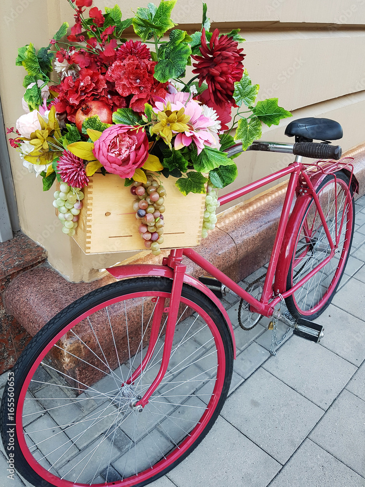 Pink bicycle with flower box