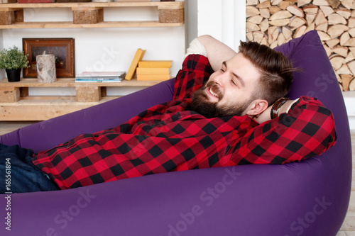 Man in inflatable hammock