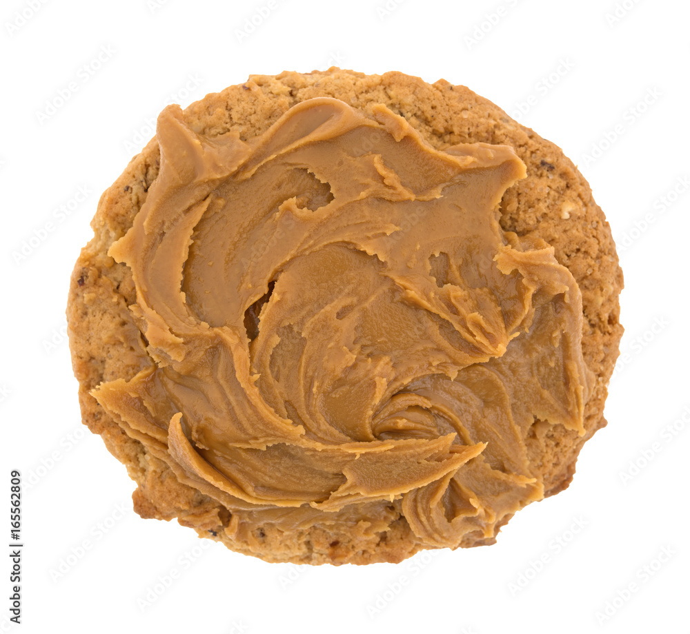 Top view of an oatmeal cookie with cookie butter topping isolated on a white background.