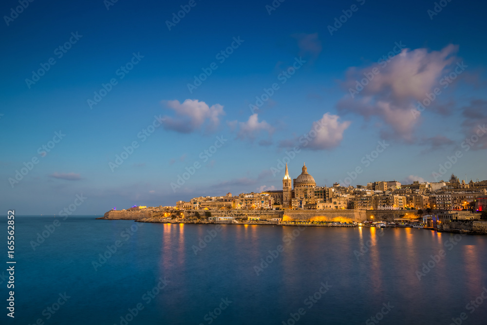 Valletta, Malta - Blue hour at the famous St.Paul's Cathedral and the city of Valletta