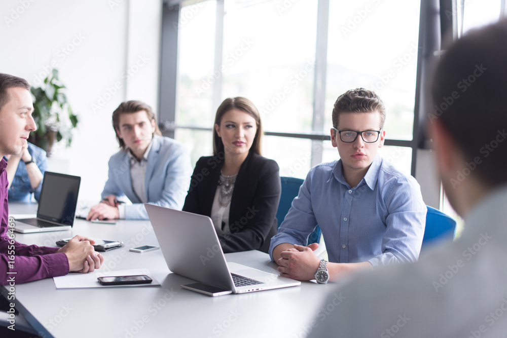 Business Team At A Meeting at modern office building Business Team At A Meeting at modern office building
