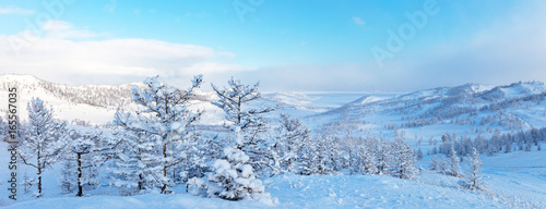 Lake Baikal. Panoramic view from the hill to the Kurkutskaja bay after the snowfall