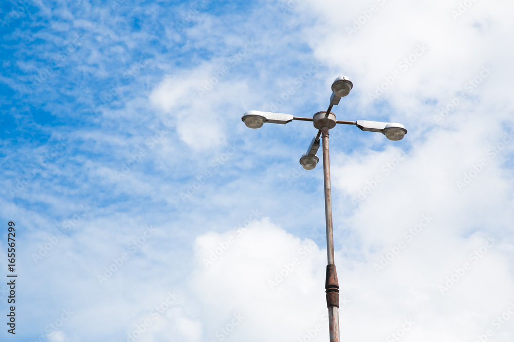 Modern street lamp against the blue sky. Modern street lamp against the blue sky.