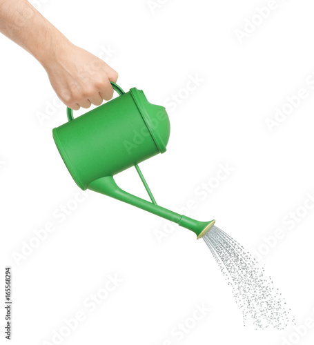 Photo Hand watering from a watering can