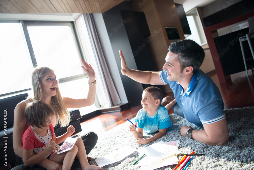 Fototapeta premium young couple spending time with kids