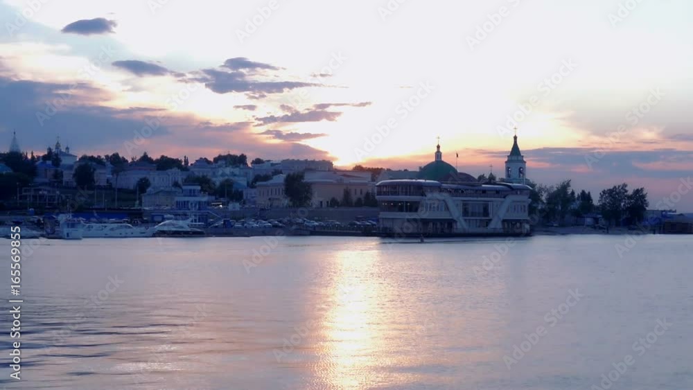Beautiful sunset on the sea, embankment. City center. Slow motion Beautiful sunset on the sea, embankment. City center. Slow motion