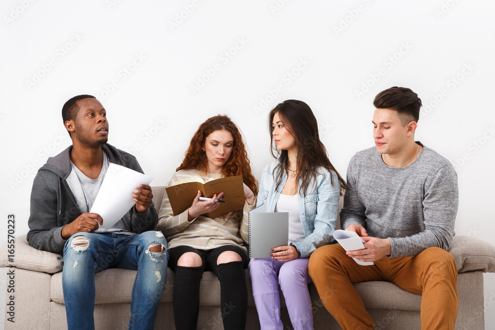 Diverse young students preparing for exam at home Diverse young students preparing for exam at home