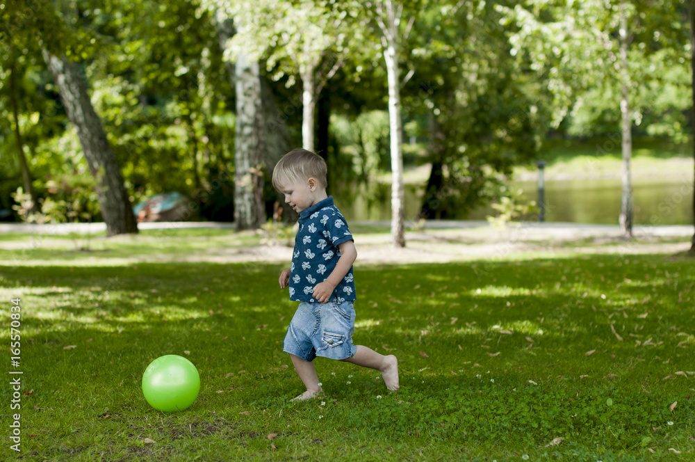 Little boy is playing with a ball Little boy is playing with a ball