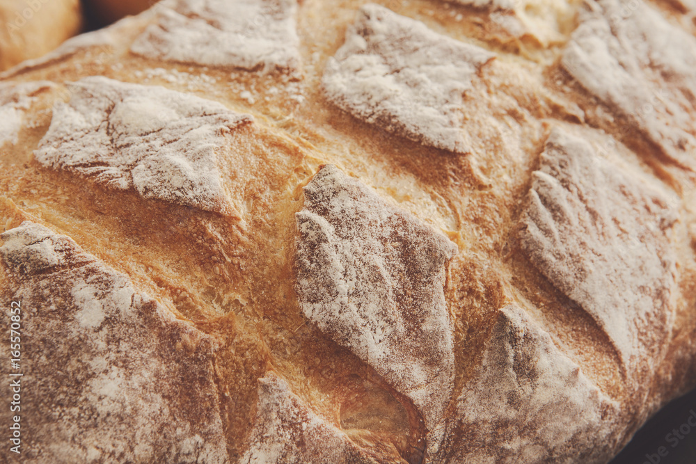 Bread texture background, closeup of baguette loaf