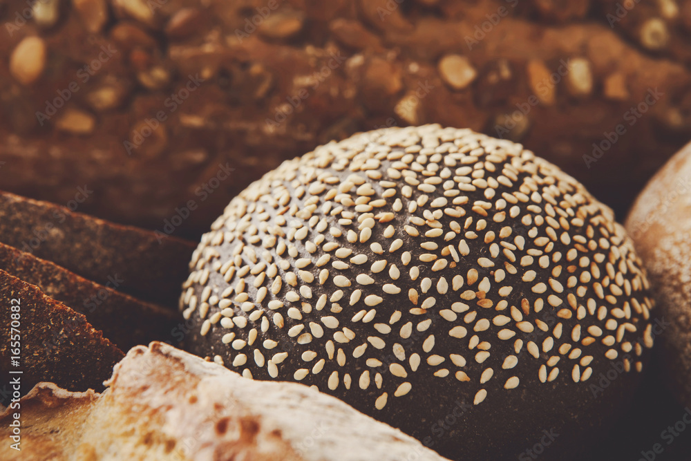 Bread background, closeup of white, black and rye loaves Bread background, closeup of white, black and rye loaves