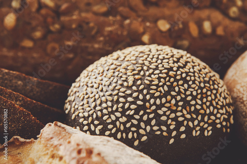 Bread background, closeup of white, black and rye loaves © Prostock-studio