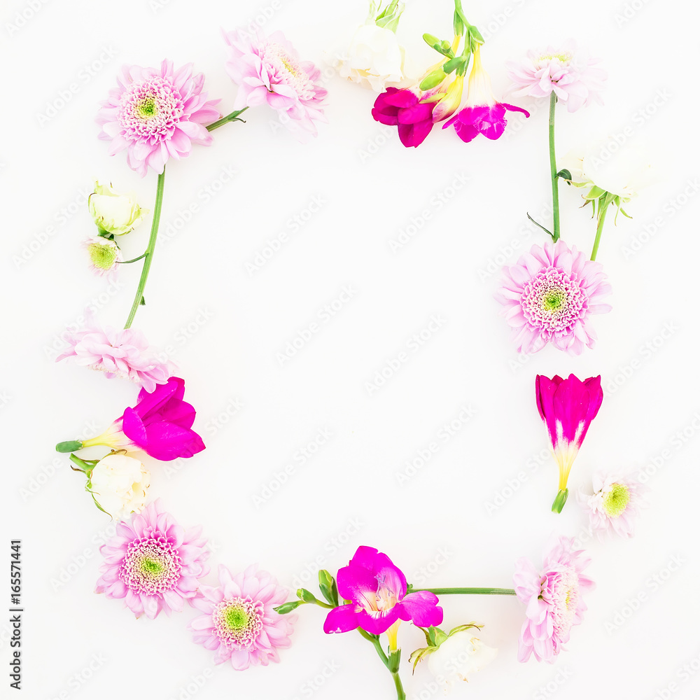 Floral frame of pink flowers on white background. Floral composition. Flat lay, top view.
