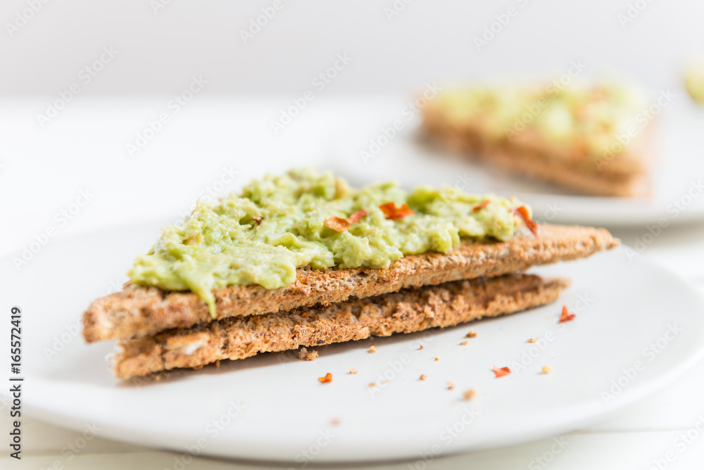 Wholemeal Bread Toast with mashed avocado and chilli flakes
