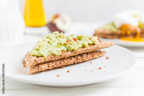 Wholemeal Bread Toast and Poached Egg with mashed avocado and ch