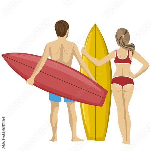 Rear view of young couple standing with their surfboards