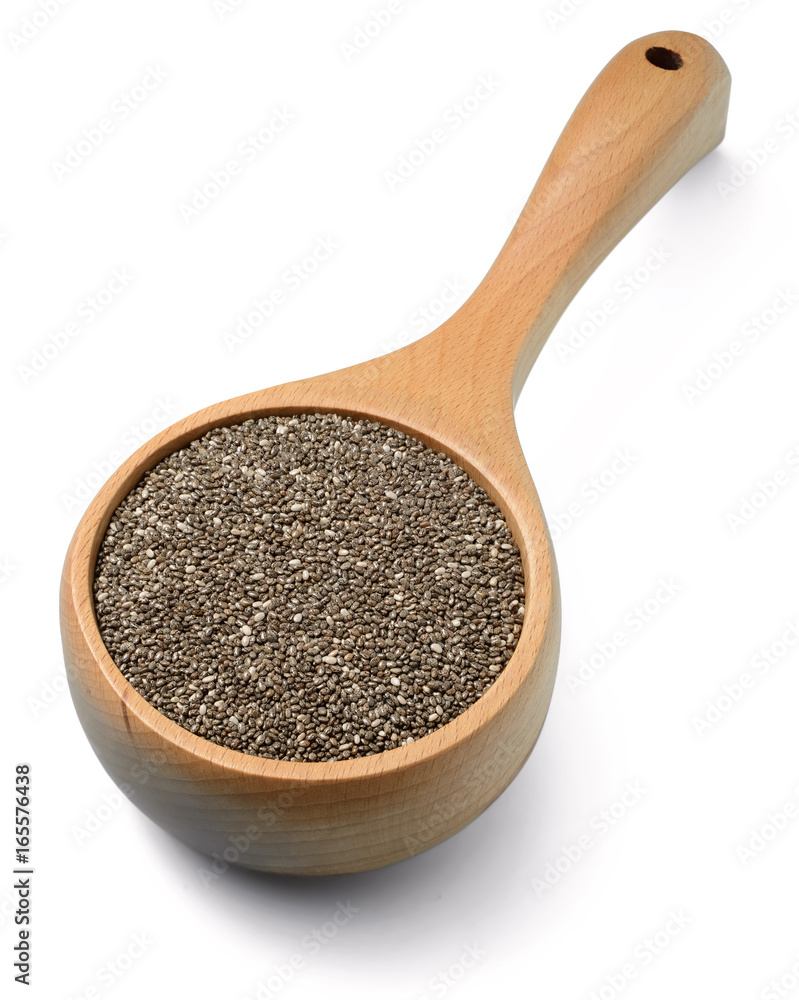 Chia seeds in the wooden shovel, isolated on white Chia seeds in the wooden shovel, isolated on white