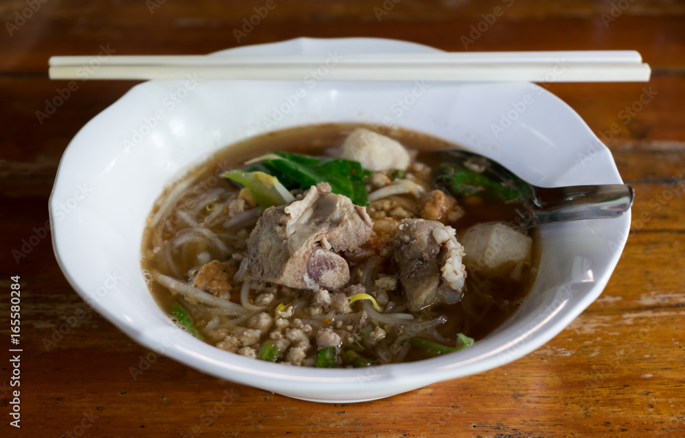 Spicy TOM YAM pork noodle soup with lemongrass, chilly pasted and lime juice. Spicy TOM YAM pork noodle soup with lemongrass, chilly pasted and lime juice.