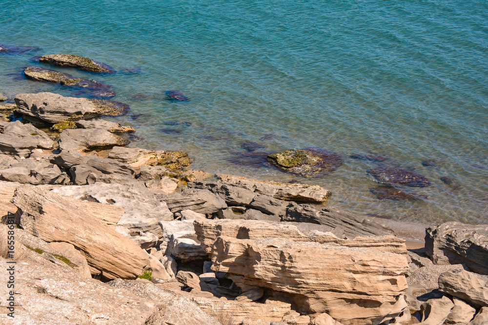 Rocky shore of warm sea Rocky shore of warm sea
