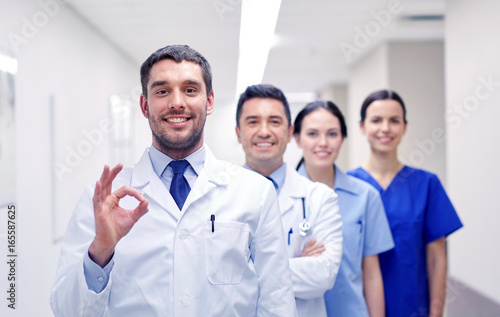 group of happy medics or doctors at hospital
