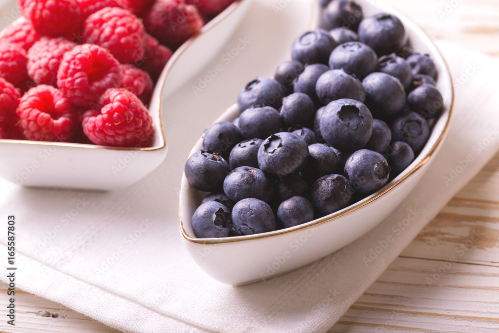 Raspberry and blueberry. Concept of healthy food. Top view Raspberry and blueberry. Concept of healthy food. Top view