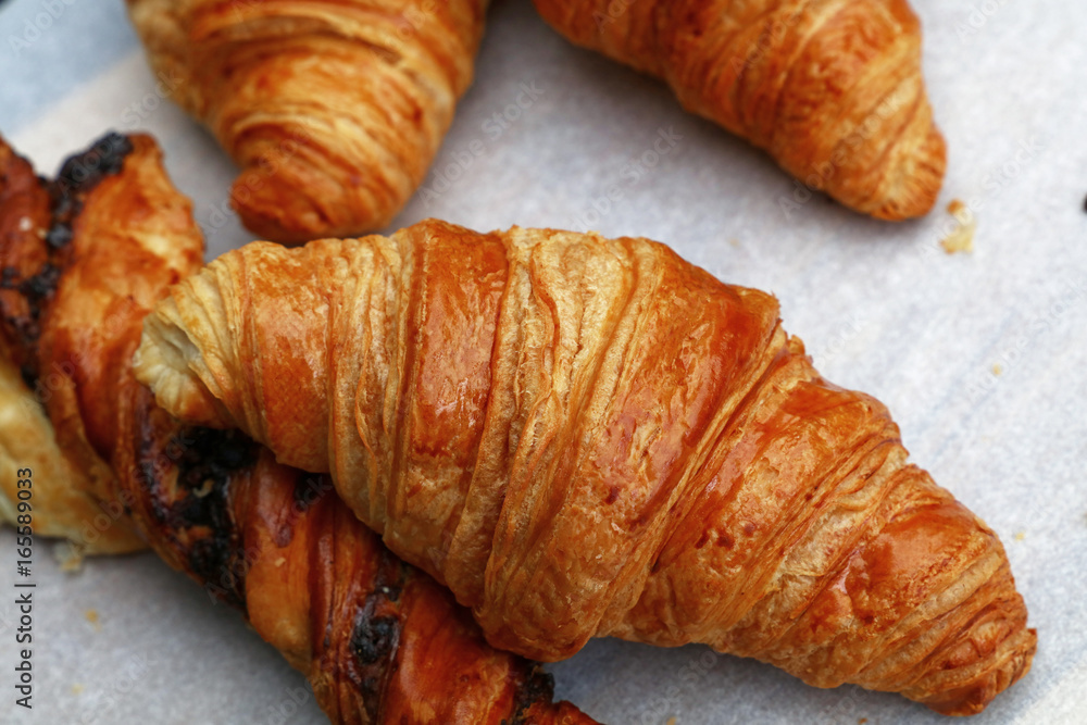 Freshly baked golden croissants close up Freshly baked golden croissants close up