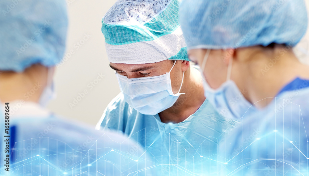 Fototapeta premium group of surgeons in operating room at hospital