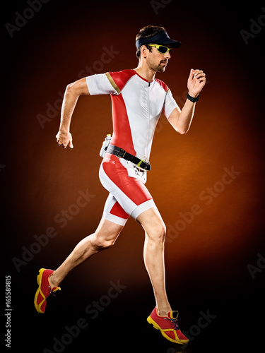one caucasian  man runner running  triathlon ironman isolated