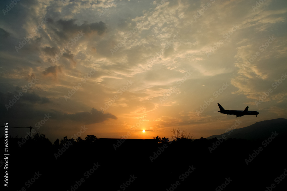 Airplane Landing with Yellow sky sunset background Airplane Landing with Yellow sky sunset background