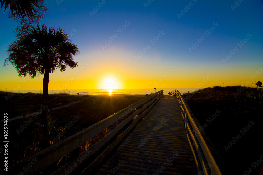 wooden walkway to the beach and ocean sunset wooden walkway to the beach and ocean sunset