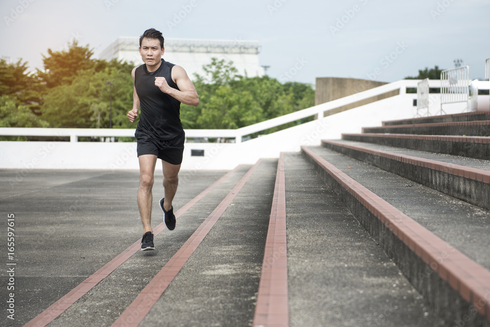Handsome Sport man running at outdoor city Handsome Sport man running at outdoor city