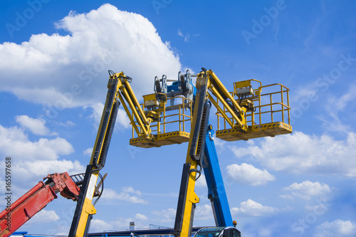 Wallpaper Mural Lift buckets in the blue sky with clouds Torontodigital.ca