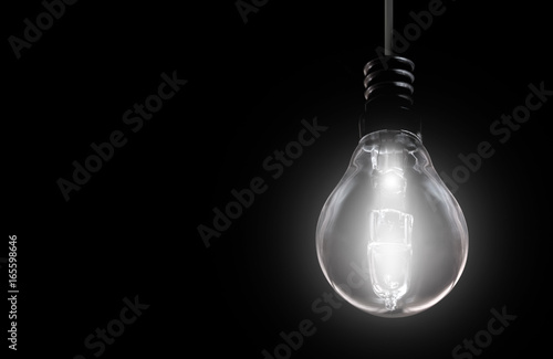 Light bulb on black background