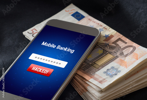Mobile banking hack and cyber security concept. Hacker and criminal login to persons online bank application and steal money from account. Smartphone and a lot of 50 euro bills. 