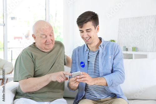 Young male volunteer and se...