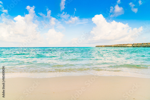 Fototapeta Naklejka Na Ścianę i Meble -  Beautiful water villas in tropical Maldives island at the sunrise time .