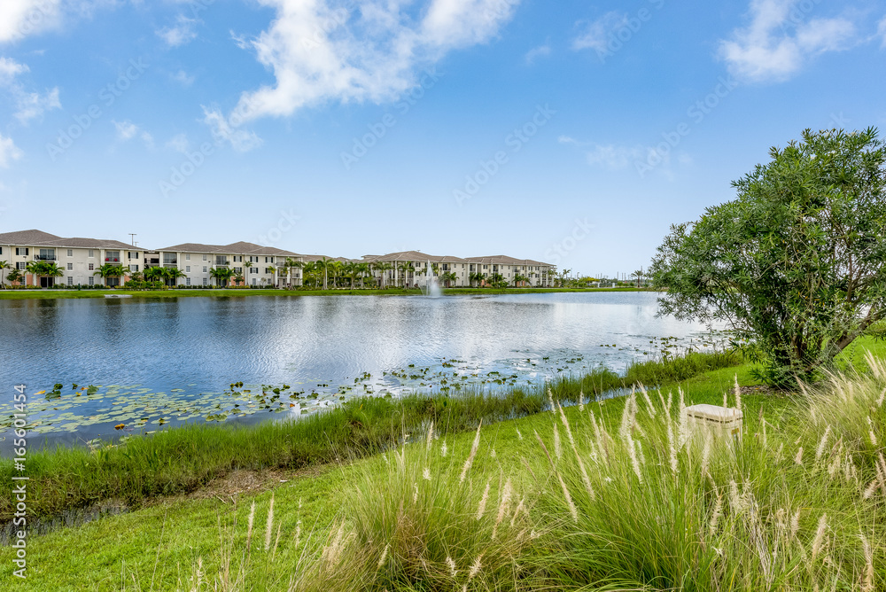 View looking out at lake and apartment buildings. 