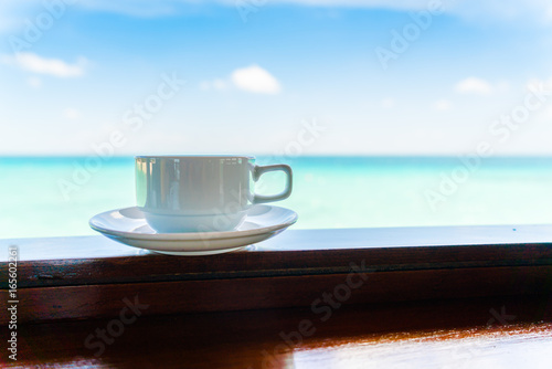 Coffee cup with Beautiful tropical Maldives island . ( Filtered image processed vintage effect. )