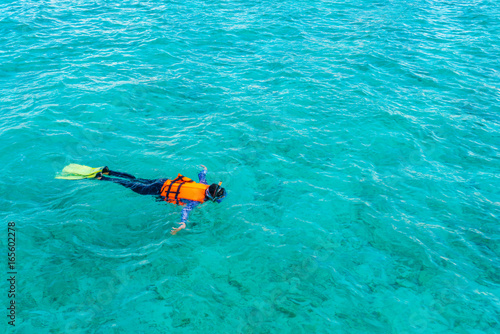 Snorkeling in tropical Maldives island .