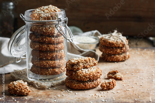 Fototapete homemade cookies with sesame seeds in a glass jar