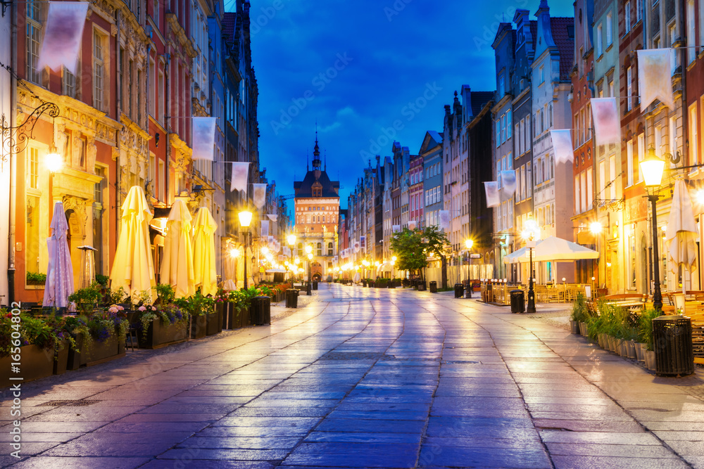 Fototapeta premium Gdansk long street at night. In the background the Gold Gate.