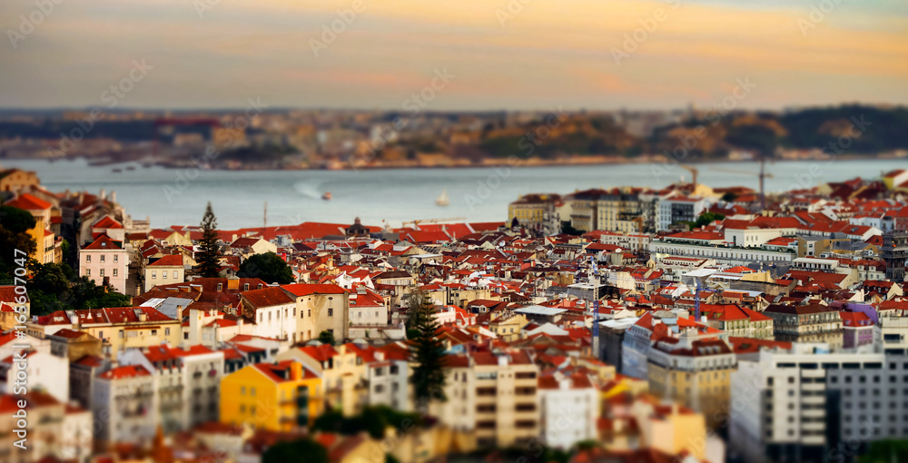 Beautiful colorful sunset landscape aerial view of Lisbon, miniature tilt-shift view