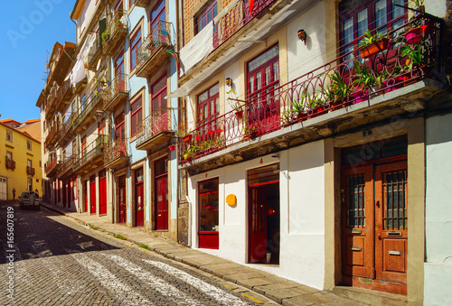 Fototapeta Naklejka Na Ścianę i Meble -  Colorful decorated facades of traditional portugal street